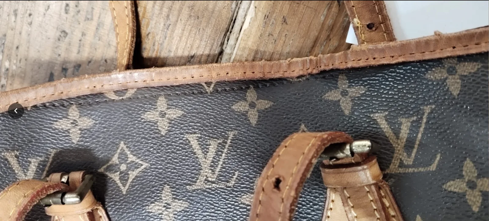 Before: damaged leather seam and handle attachment on a Louis Vuitton bag