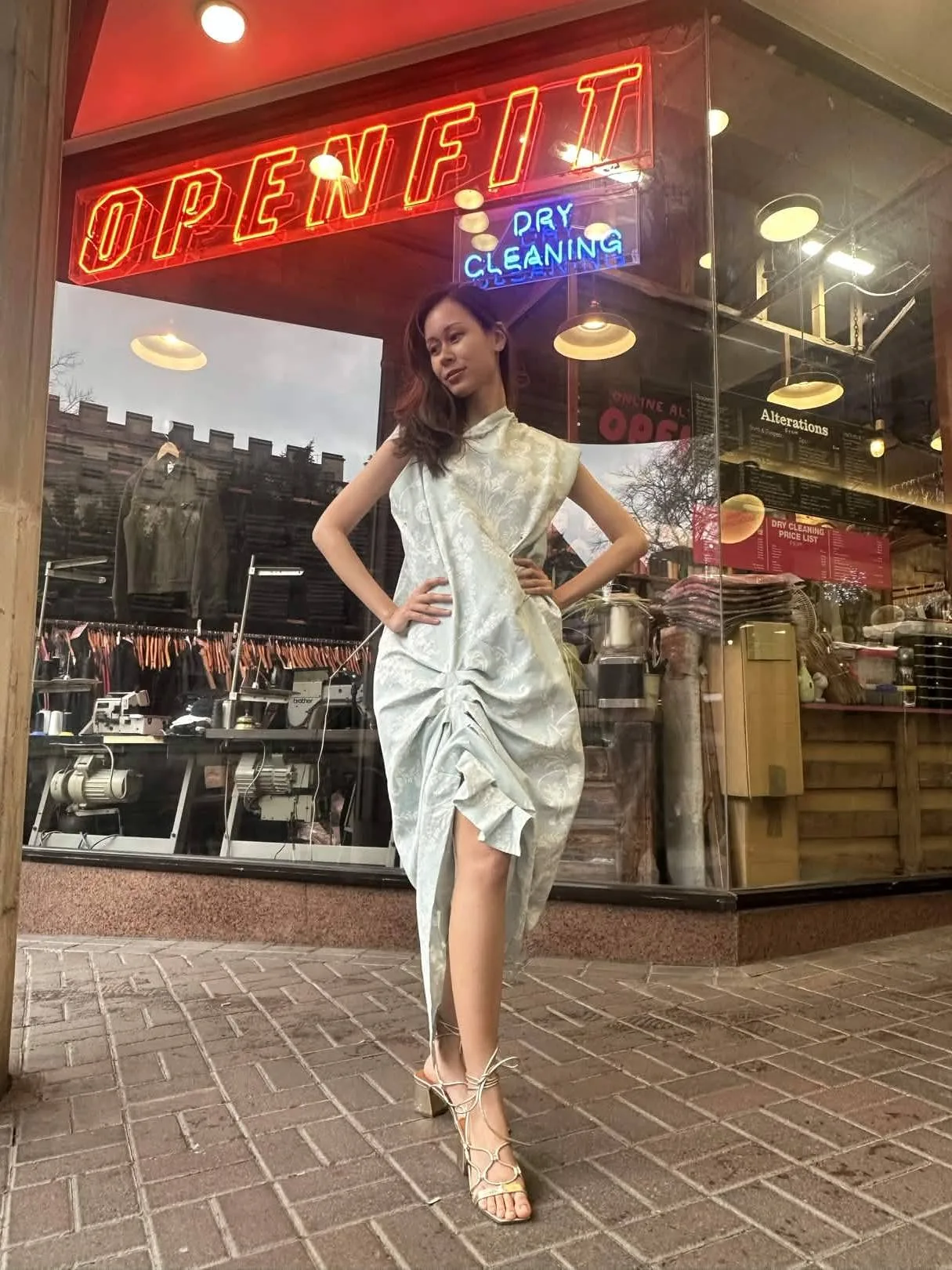 Light green and silver draped dress, suitable as an occasionwear example