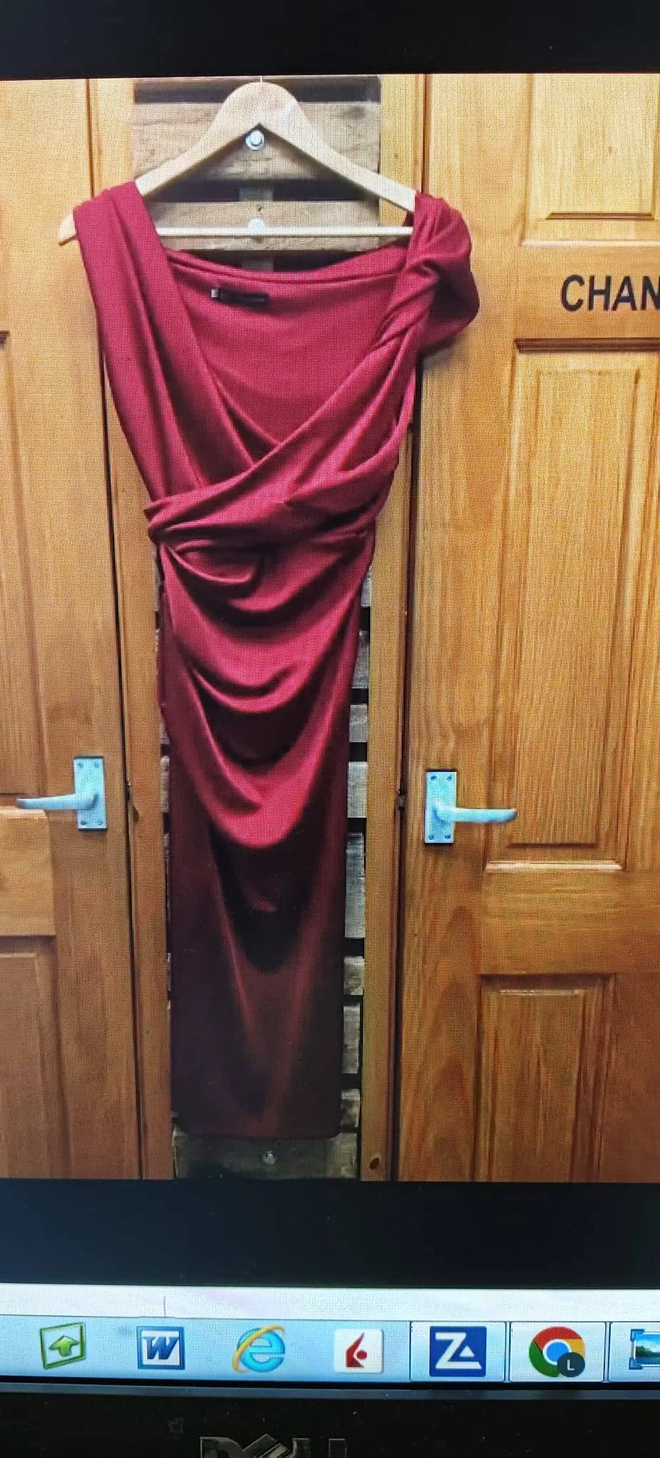 Red asymmetric draped dress, suitable as an occasionwear example