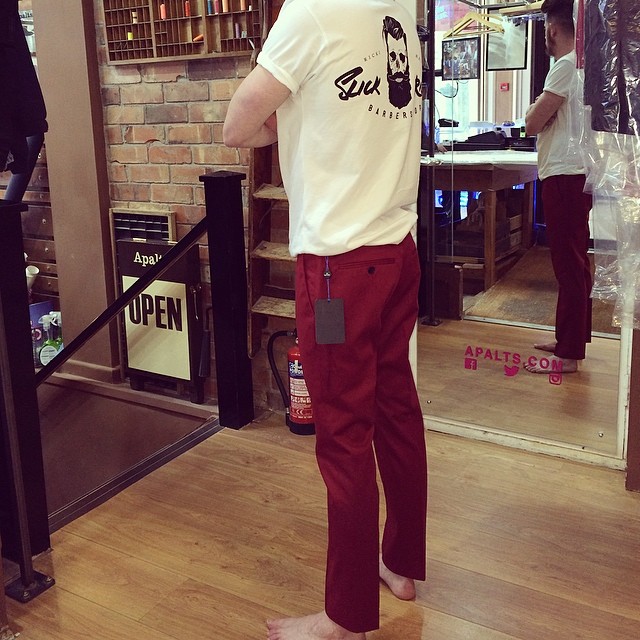 Red trousers being checked during an Openfit fitting