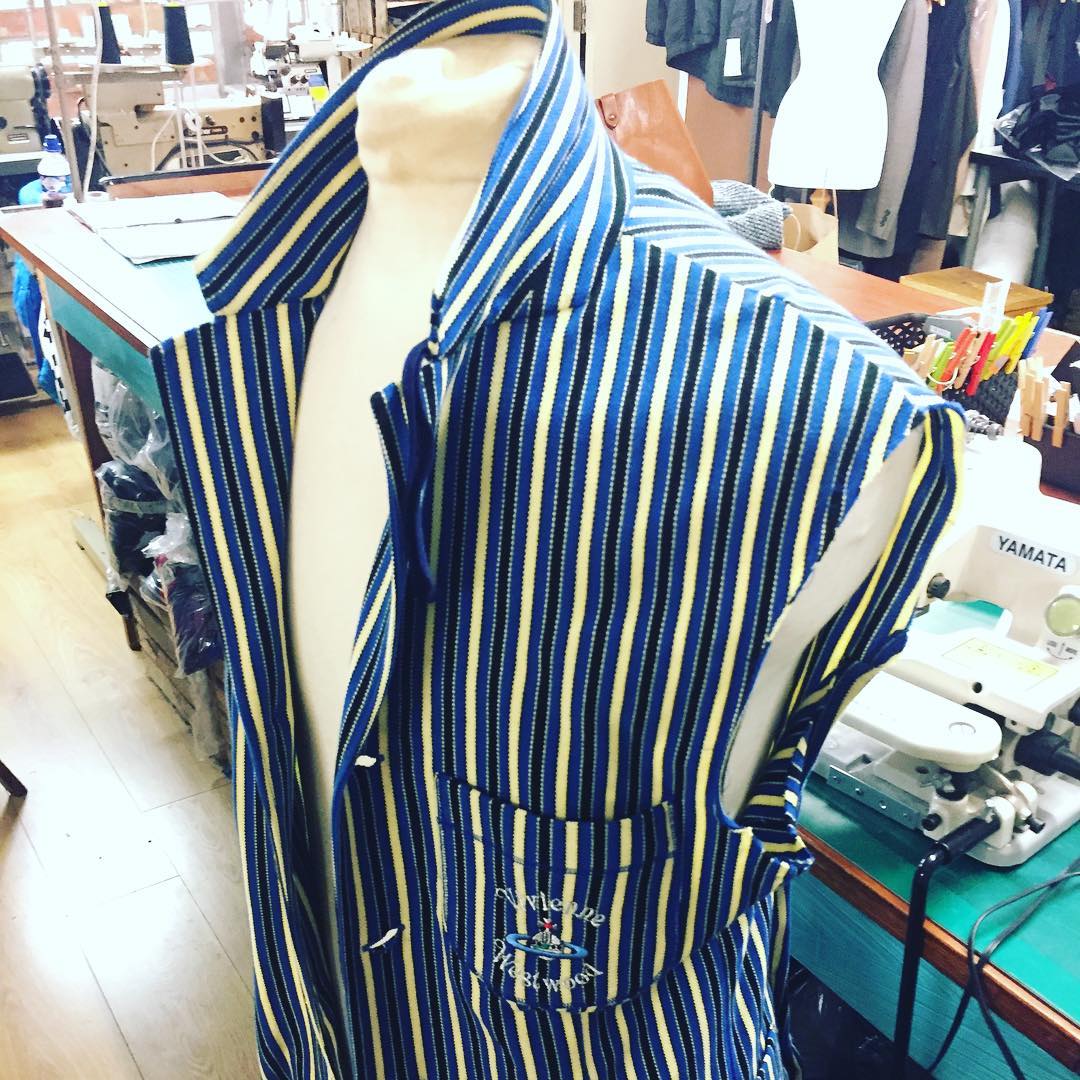 Blue and yellow striped jacket on a dress form in the Openfit workroom